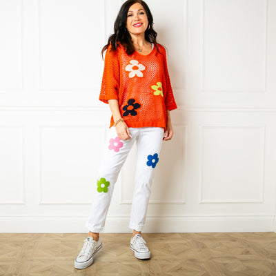 The orange Crochet Flower Top with 3/4 length sleeves and a v neckline